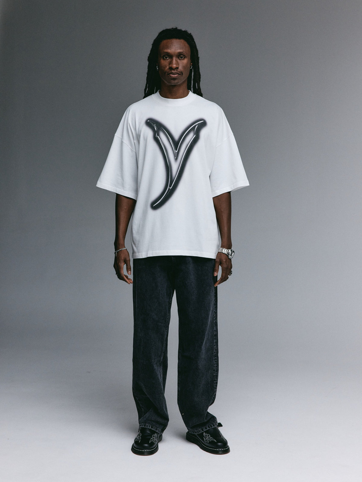 Dante wearing the YEMAT Airbrush Tee