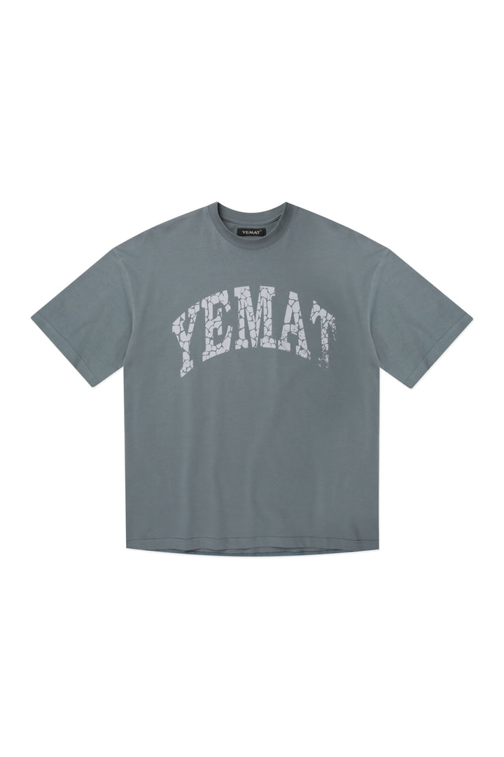 YEMAT Fracture Tee in deep teal, flat lay front showing the full oversized silhouette, 240 GSM organic cotton