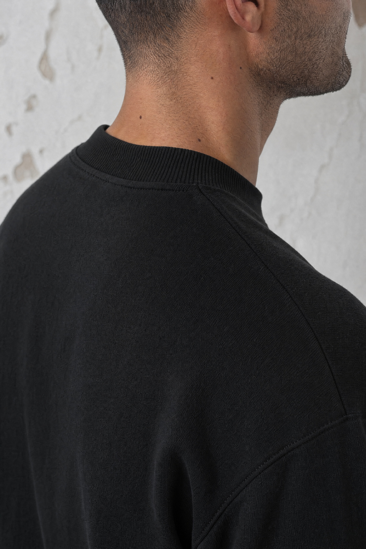 YEMAT Relic Jumper black — collar and dropped-shoulder construction detail