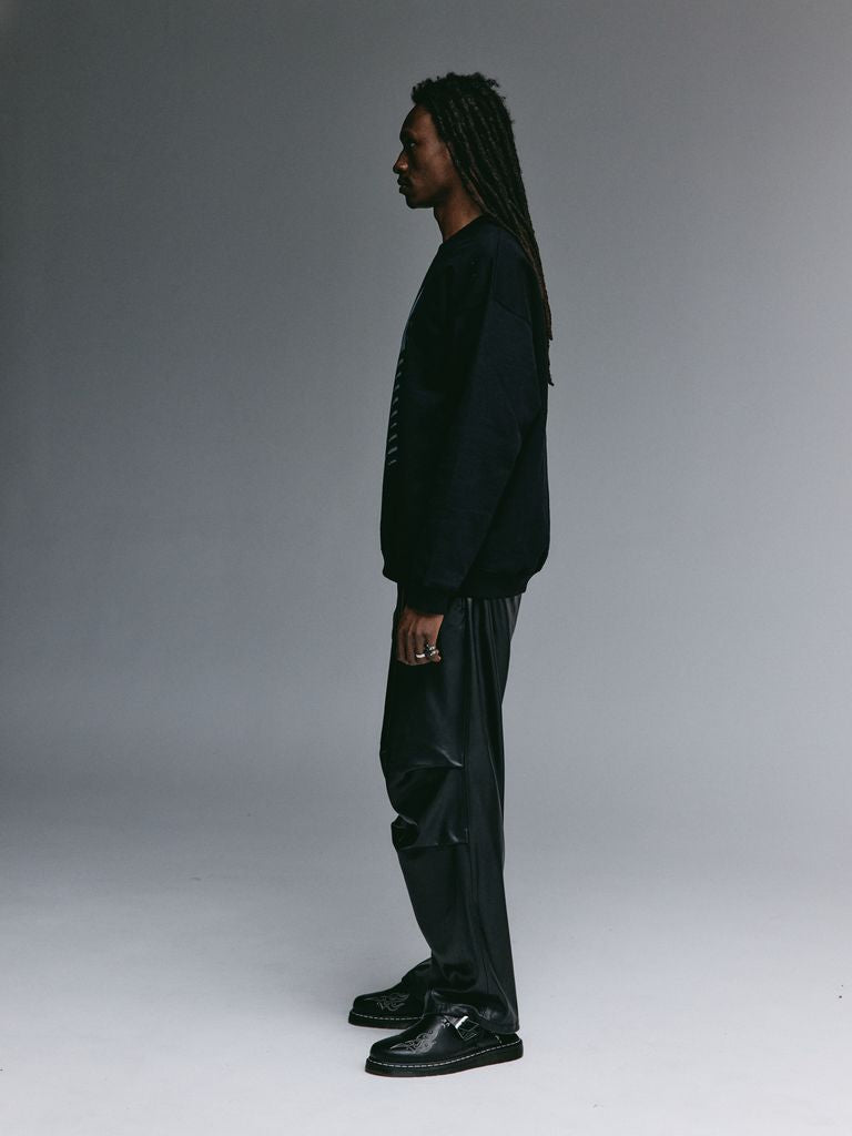 Dante wearing the YEMAT Relic Jumper