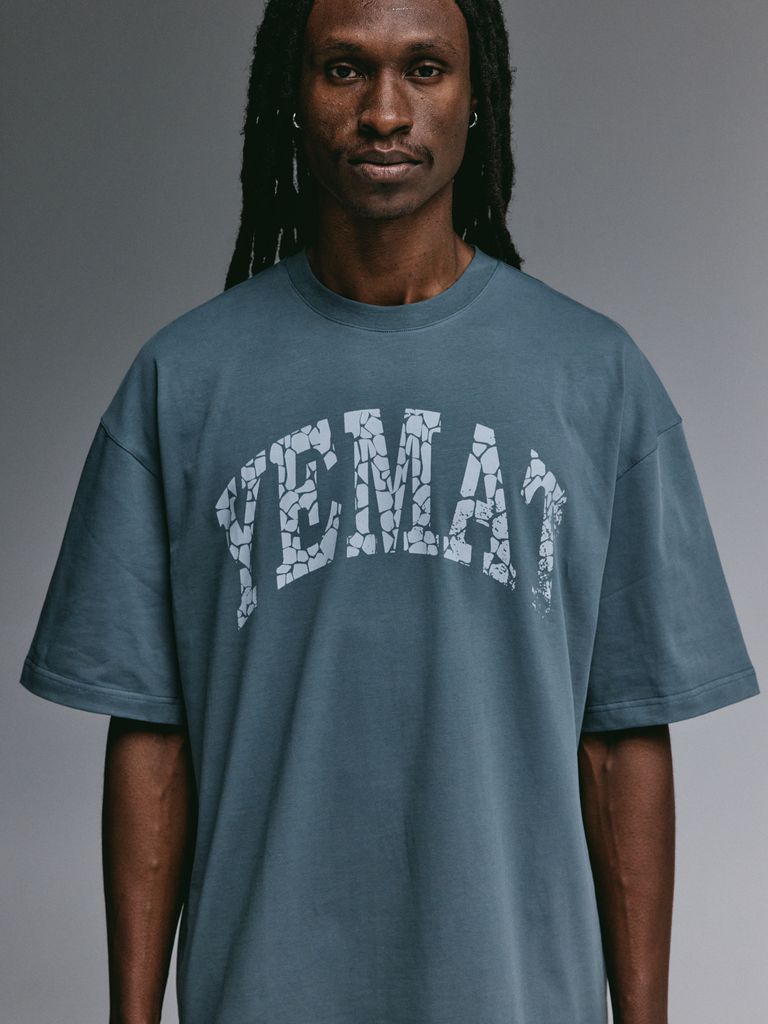 Dante wearing the YEMAT Fracture Tee